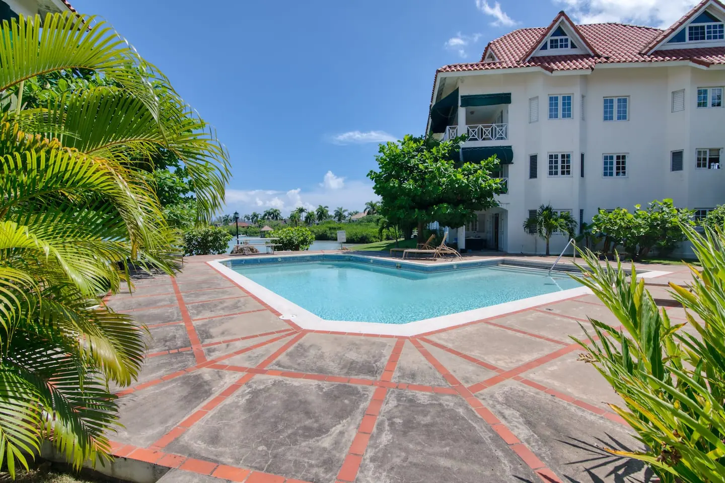 Shared outdoor swimming pool within the Lagoons community.