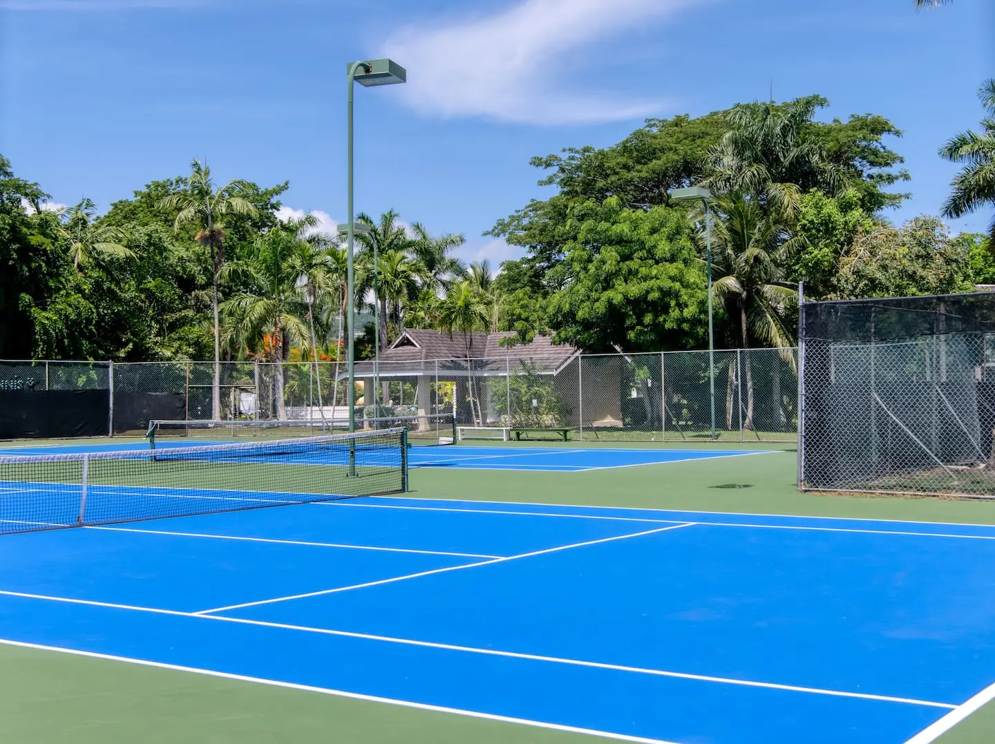 Shared tennis courts within the Lagoons community.